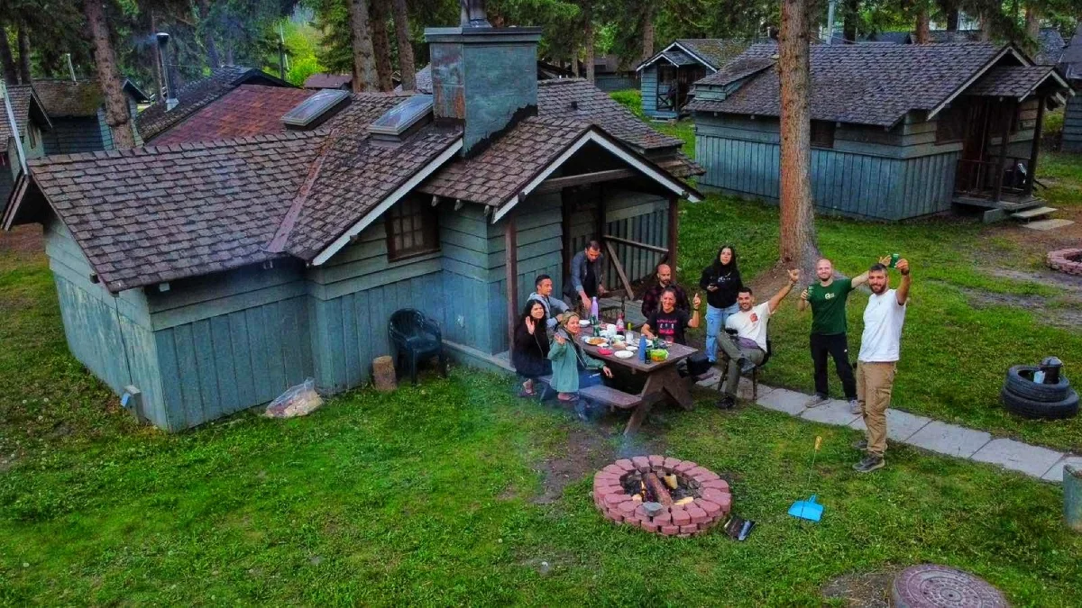 Our Altervan crew outside wooden cabins